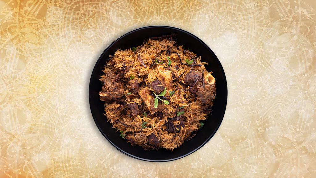 Classic Goat Biryani · Long grained rice flavored with fragrant spices flavored along with saffron and layered with bone-in goat meat and cooked with biryani masala gravy