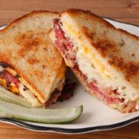 The OG Reuben · *now with 20% more meat!* choice of pastrami, corned beef, or smoked turkey griddled with ru...