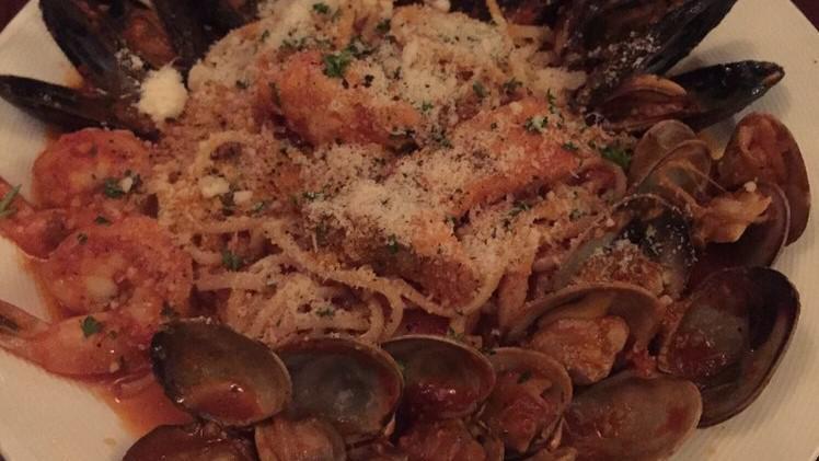 Pescatore · With prawns, mussels, clams & salmon in a white wine marinara.