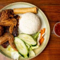 Combo Plate · Grilled pork chop, 2 chicken wings & egg roll w/steamed rice.