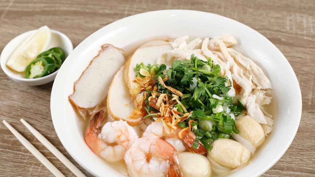 7. House Special Noodle Soup · Combination rice noodle soup. Serve dry or wet. Thick wide rice noodle soup with shrimp, fish cake, slices of pork, ground pork and chicken.