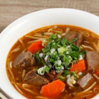 9. Beef Stew · -beef, carrot slow cook in tomato puree and spice serve with choice of egg noodle, rice nood...