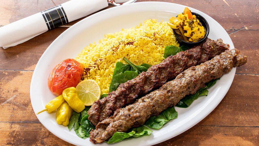 Persian Beef Kebab (Kubideh) · Two skewers of grass fed beef kebabs,  fire roasted tomatoes and basmati rice.