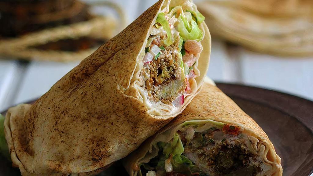 Falafel Wrap · w/hummus, spinach,Egyptian style falafel 
peperoncino & tomato. Comes with kale or soup