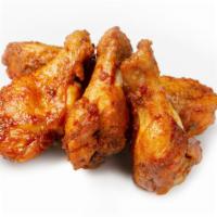 Famous Hot Wings · Gourmet hot wings cooked in our unique method that comes with your favorite side of dressing.
