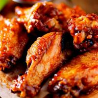 Bbq Wings · Fresh batch of wings smothered in a tangy, BBQ sauce and served with a side of ranch.
