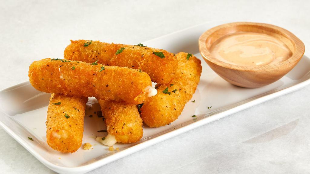 Mozzarella Cheese Sticks · Six pieces of warm mozzarella cheese sticks made with mozzarella cheese and fontina cheese dipped with house made marinara sauce.