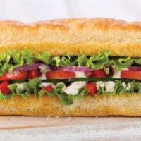 Veggie · Feta, cucumber, red peppers, red onions, lettuce, roma tomato and creamy Mediterranean dress...
