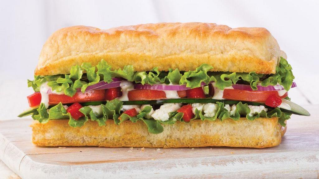 Veggie · Feta, cucumber, red peppers, red onions, lettuce, roma tomato and creamy Mediterranean dressing.