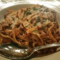 Fettuccine Alla Bolognese · Imported Rummo pasta with ragu meat sauce.