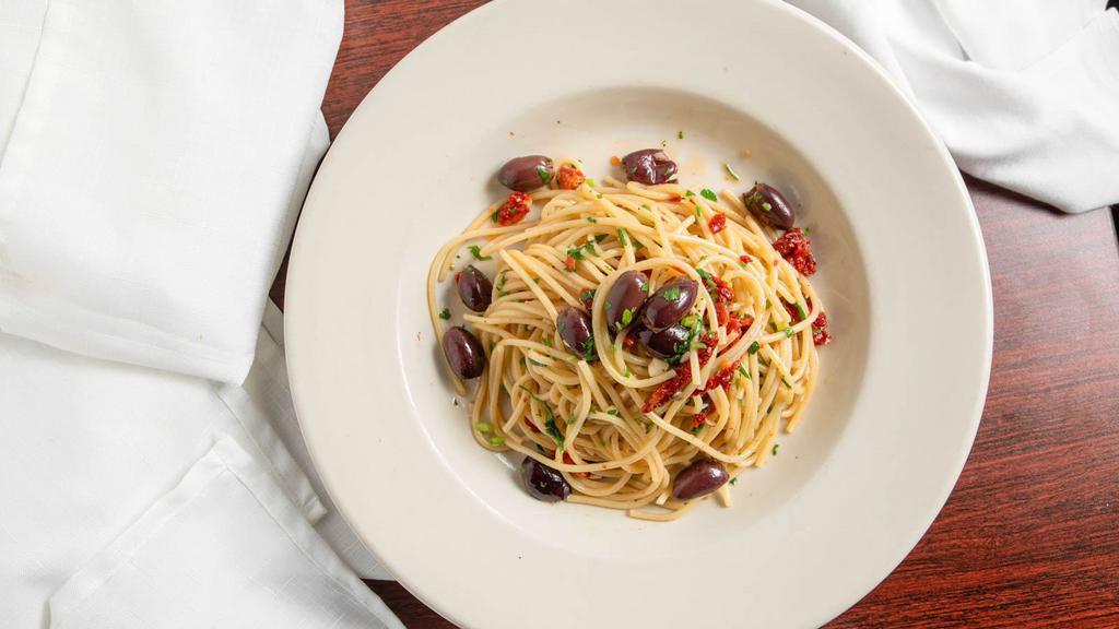 Spaghetti Aglio, Olio E Peperoncino · Vegetarian. Sautéed with garlic, red hot chili pepper, black olives, extra virgin olive oil and sun-dried tomatoes.