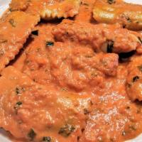 Ravioli Anna · Vegetarian. Homemade pasta filled with fresh ricotta cheese and spinach served in a blended ...