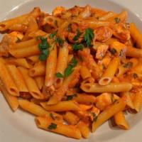 Penne Al Salmone · Imported Rummo® pasta, sautéed with fresh salmon and served in a tomato-vodka cream sauce.