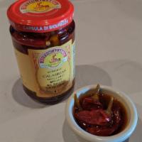 PEPERONCINI CALABRESI · 1 JAR OF IMPORTED SOUTHERN ITALIAN CALABRIAN HOT CHILI PEPPERS (WHOLE PEPPERS). NET WEIGHT 9...