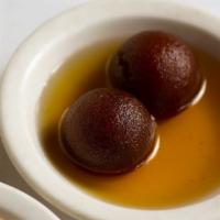 Gulab Jamun · Made with dry milk and homemade cheese balls fried and soaked in warm sugar syrup.