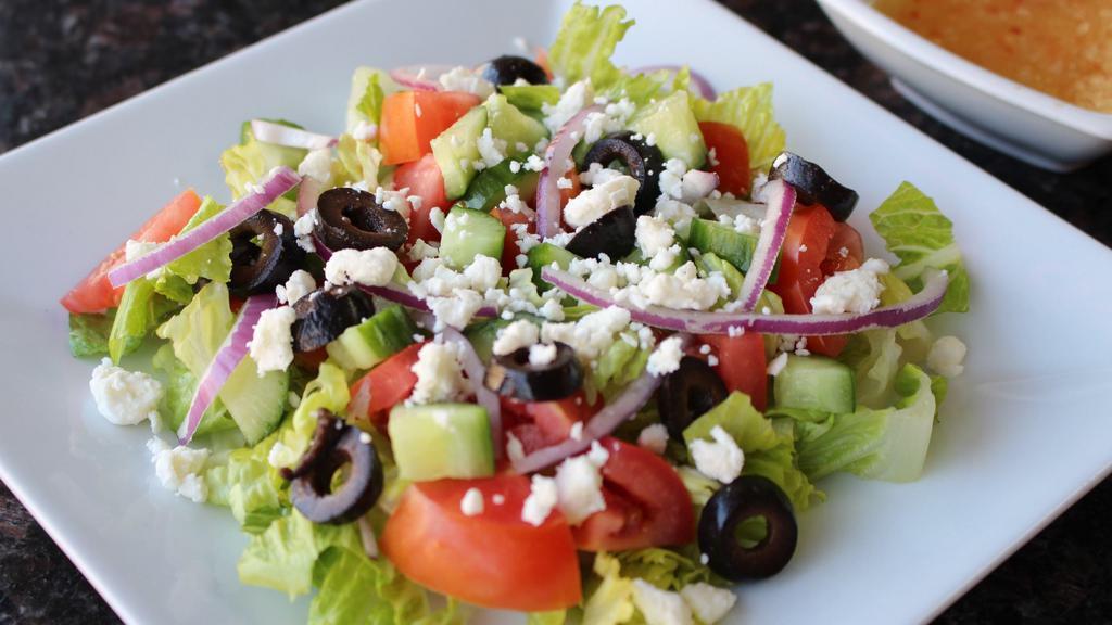 Greek Salad · Feta cheese, Baby cucumber, Tomato, Lettuce, Onion & Black olive.