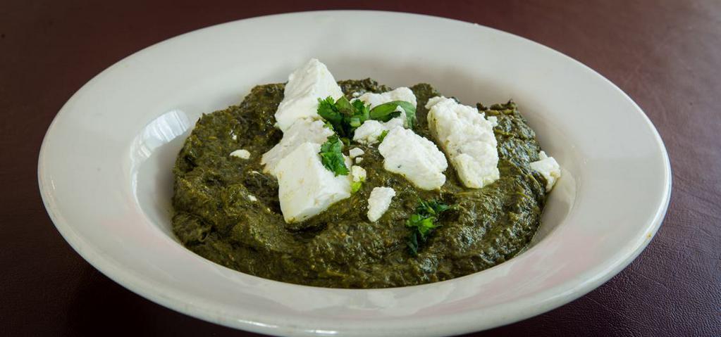 Palak Paneer · Tender cubes of paneer sautéed in slow-cooked spinach and flavored spices.