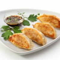 Steamed Meat Dumpling · Six pieces of a mix of cabbage, soy sauce, veggies, and meat all wrapped in a dumpling wrapp...