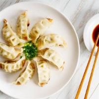 Steamed Vegetable Dumpling · Six pieces of a mix of cabbage, soy sauce, and a load of veggies all wrapped in a dumpling w...