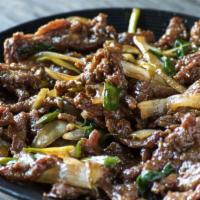 Mongolian Beef · Saucy flank steak, combined with caramelized onions, grilled scallions, and fresh vegetables.