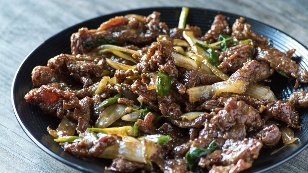 Mongolian Beef · Saucy flank steak, combined with caramelized onions, grilled scallions, and fresh vegetables.