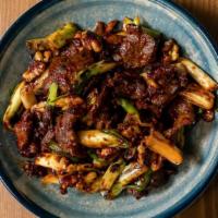 Crispy Szechuan Style Beef · Flank steak tossed with chili garlic sauce, soy sauce, and a mix of fresh vegetables.