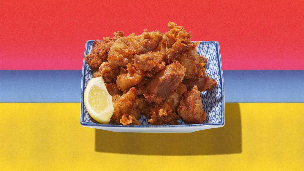 Crispy Chicken Karaage · Deep-fried pieces of marinated chicken served with dipping sauce.