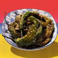 Shishito Peppers · Blistered shishito peppers with olive oil, lemon, and sea salt.