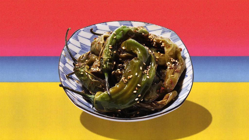 Shishito Peppers · Blistered shishito peppers with olive oil, lemon, and sea salt.