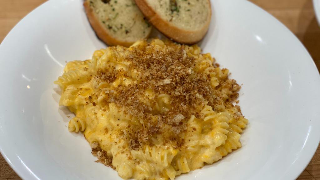 Mac & Cheese · Creamy cheddar sauce, rotini topped with bread crumbs.