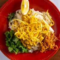 House Special Noodle · Burmese special. Flat noodle with coconut chicken, lime leaves, yellow pea's powder, onion a...