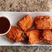 Paneer Pakoras · Indian cheese dipped in chickpea batter, ginger garlic, and Indian spices.