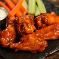 Classic Buffalo · 8 traditional wings tossed in classic buffalo (medium heat), served with carrots & celery an...