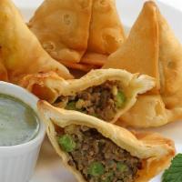 9. Meat Samosa (2 pieces) · Spiced ground lamb and green peas.