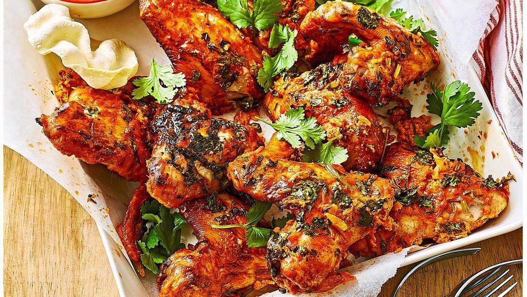 12. Tandoori Chicken Wings · Chicken wings marinated in yogurt with spices and cooked in clay oven.