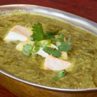 56. Saag Paneer · Fresh spinach cooked with herbs, spices with homemade cheese cubes.