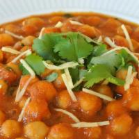 59. Channa Masala · Garbanzo beans cooked in curry sauce with spices.