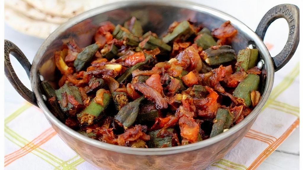 64. Bhindi Masala · Fresh okra cooked with onions and spices.