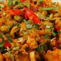 58. Spicy Vegetable Jalfraze · Mixed vegetables cooked w/ bell peppers, onions, cheese, ginger, garlic & spices.