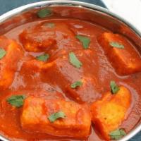 42. Paneer Tikka Masala · Fresh homemade cheese cubes cooked with herbs & spices in tomato sauce.