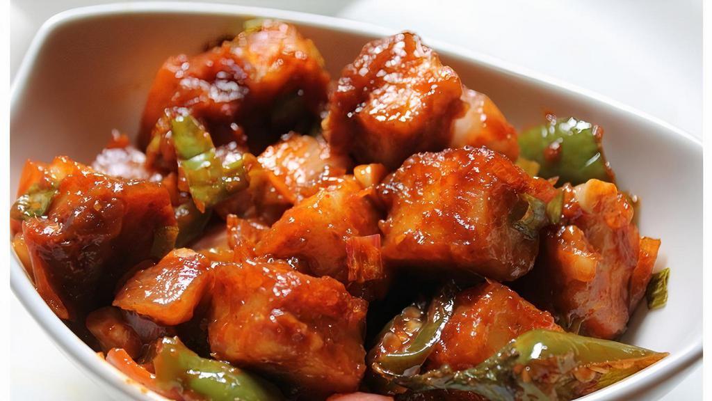 43. Paneer Chili · Fresh homemade cheese cooked with bell pepper, onions and hot spices.