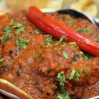 70. Lamb Vindaloo · A very hot lamb curry-served with potatoes in tangy sauce.