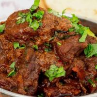 Bone-In Lamb Curry · Lamb on the bones cooked in traditional authentic Indian curry sauce.