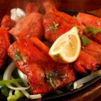 36. Chicken Tandoori · Chicken legs marinated in yogurt with spices and barbecued.