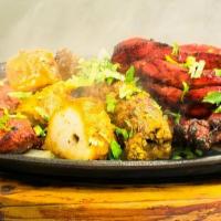 41. Mixed Platter · Combination of prawns, chicken tikka, ch. tandoori, lamb boti and lamb seekh kabab.