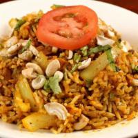 94. Vegetable Biryani · Basmati rice cooked with an assortment of vegetables, nuts & fresh herbs.