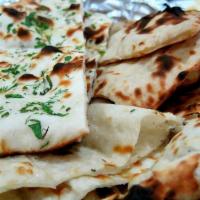 27. Assorted Bread · One each of garlic naan, chappati, onion kulcha.