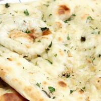 25. Chili Cheese Naan · Naan stuffed with homemade cottage cheese and chilies.