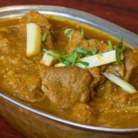 32. Lamb Korma · Mild lamb curry cooked with yogurt, nuts & spices.
