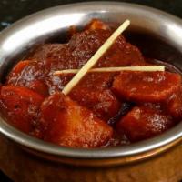 Lamb Curry · Dairy. A classic lamb preparation, lamb cooked in traditional onion-tomato sauce. Flavored w...